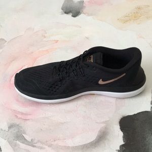 black nike with gold swoosh